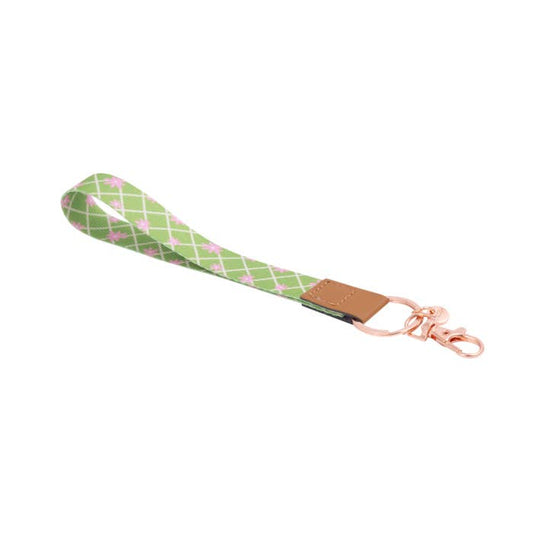Teacher Green Daisy Fabric Wristlet Keychain by Splosh showing the wrist loop and clip