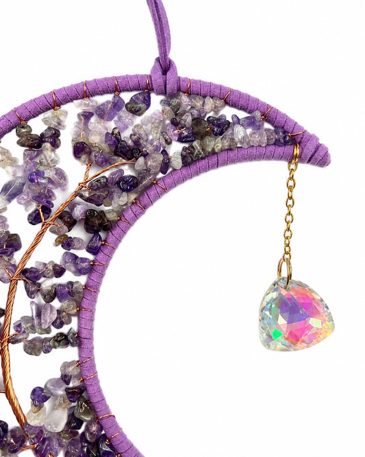 Close-up of a purple crescent moon dream catcher handcrafted with natural crystal chips and a faceted rainbow crystal ball.