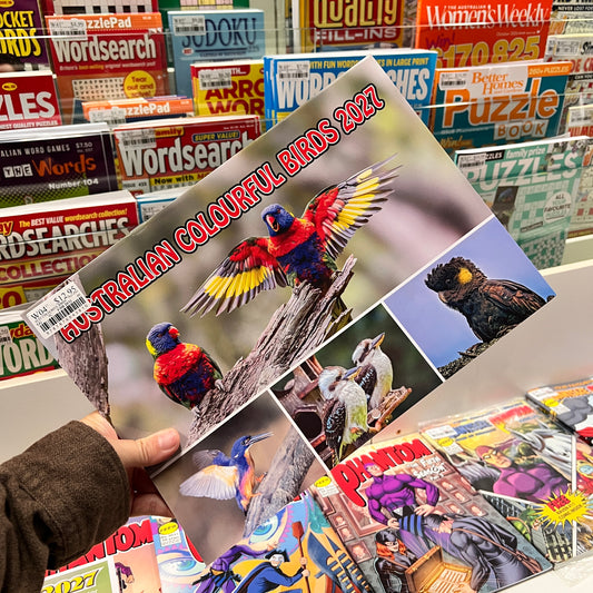 A hand holds a Cal titled 'Australian Colourful Birds 2027' featuring colorful bird illustrations on the cover