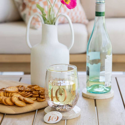 Celebration 40th Glitter Stemless Glass & Badge Set by Splosh in a styled birthday display