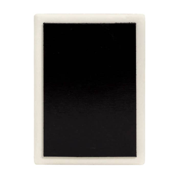 Reverse of a Splosh ceramic magnet showing the magnetic backing