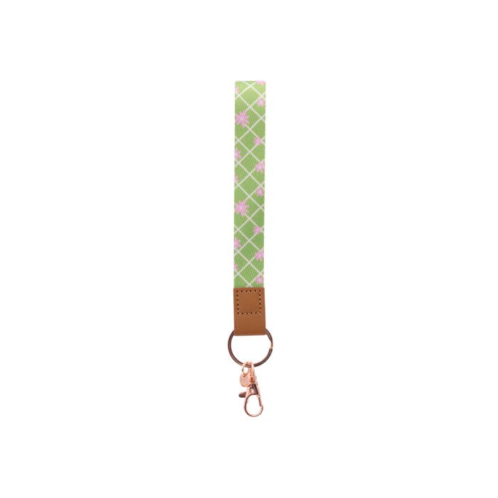 Teacher Green Daisy Fabric Wristlet Keychain by Splosh showing the wrist loop and clip