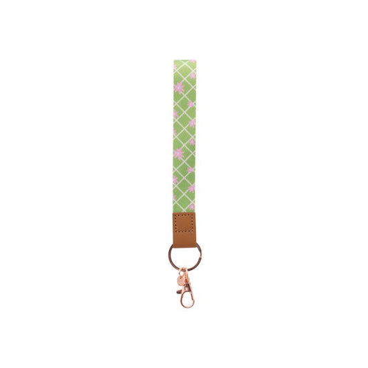 Teacher Green Daisy Fabric Wristlet Keychain by Splosh showing the wrist loop and clip