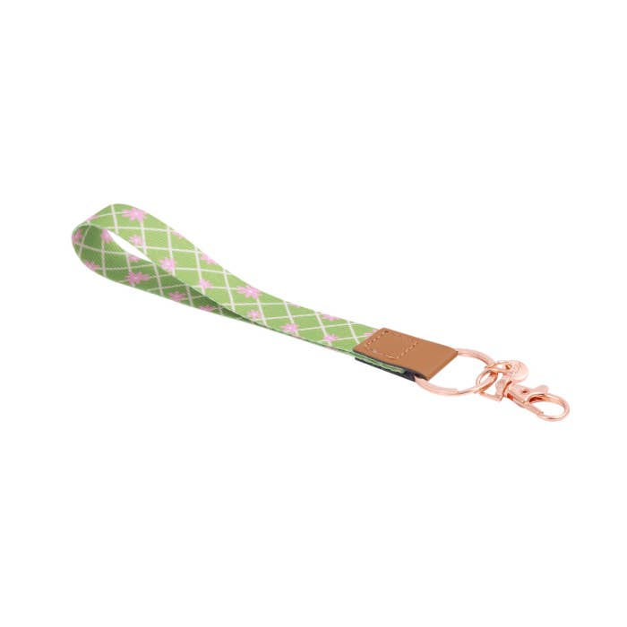 Teacher Green Daisy Fabric Wristlet Keychain by Splosh showing the wrist loop and clip