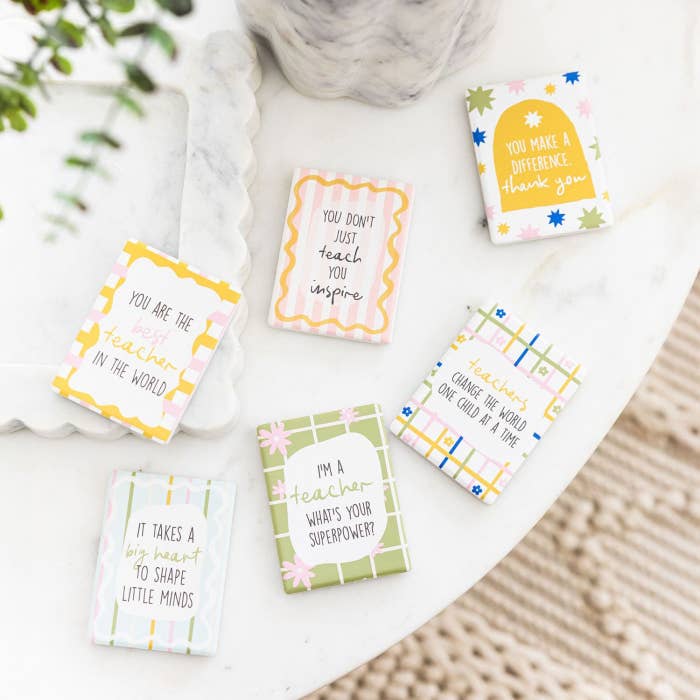 Splosh teacher ceramic magnets displayed together with appreciation messages