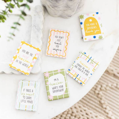 Splosh teacher ceramic magnets displayed together with appreciation messages