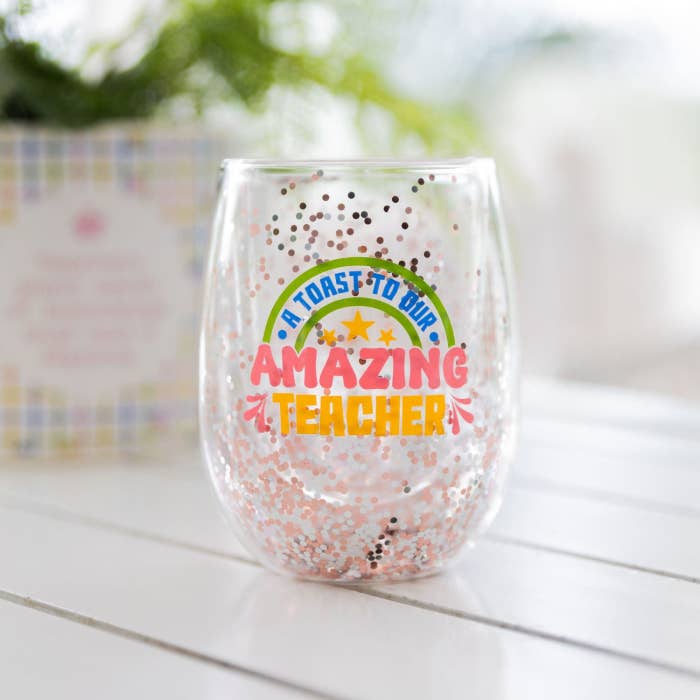 Teacher Amazing Glitter Wine Glass by Splosh in a styled glassware display
