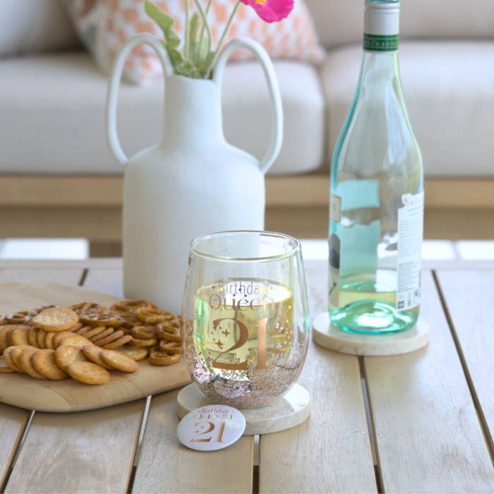 Celebration 21st Glitter Stemless Glass & Badge Set by Splosh in a styled birthday setting