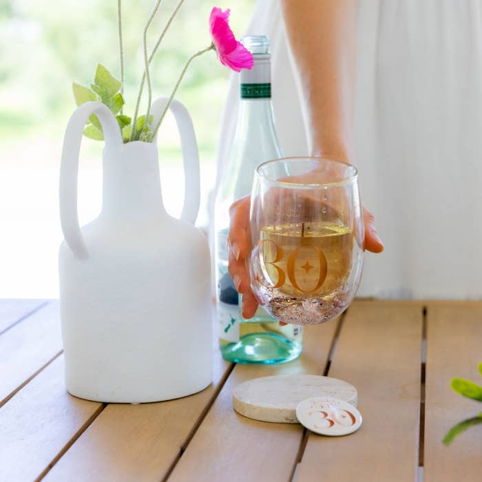 Celebration 30th Glitter Stemless Glass & Badge Set by Splosh in a styled birthday setting