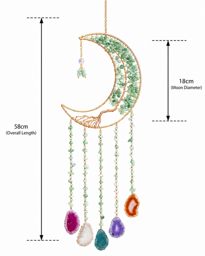 Gold crescent moon suncatcher ornament with green crystal accents and hanging agate stones, shown with dimension labels indicating 58cm overall length and 18cm moon diameter on a white background.