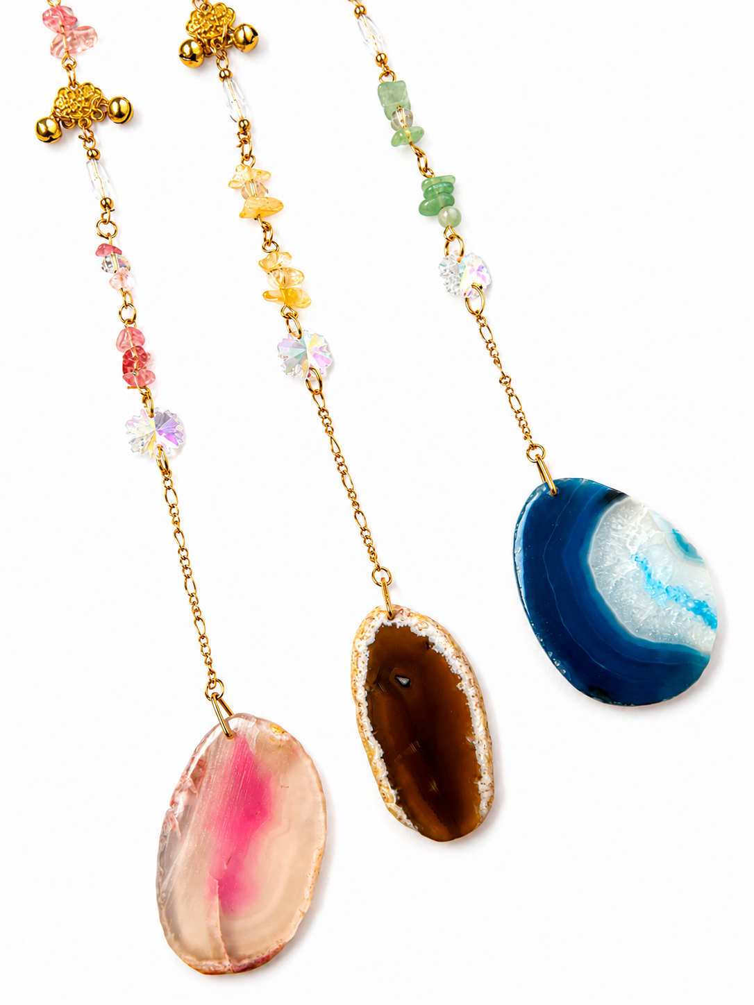 Three gold chain hanging pendant with colorful agate stone pendants, displayed against a solid white background.