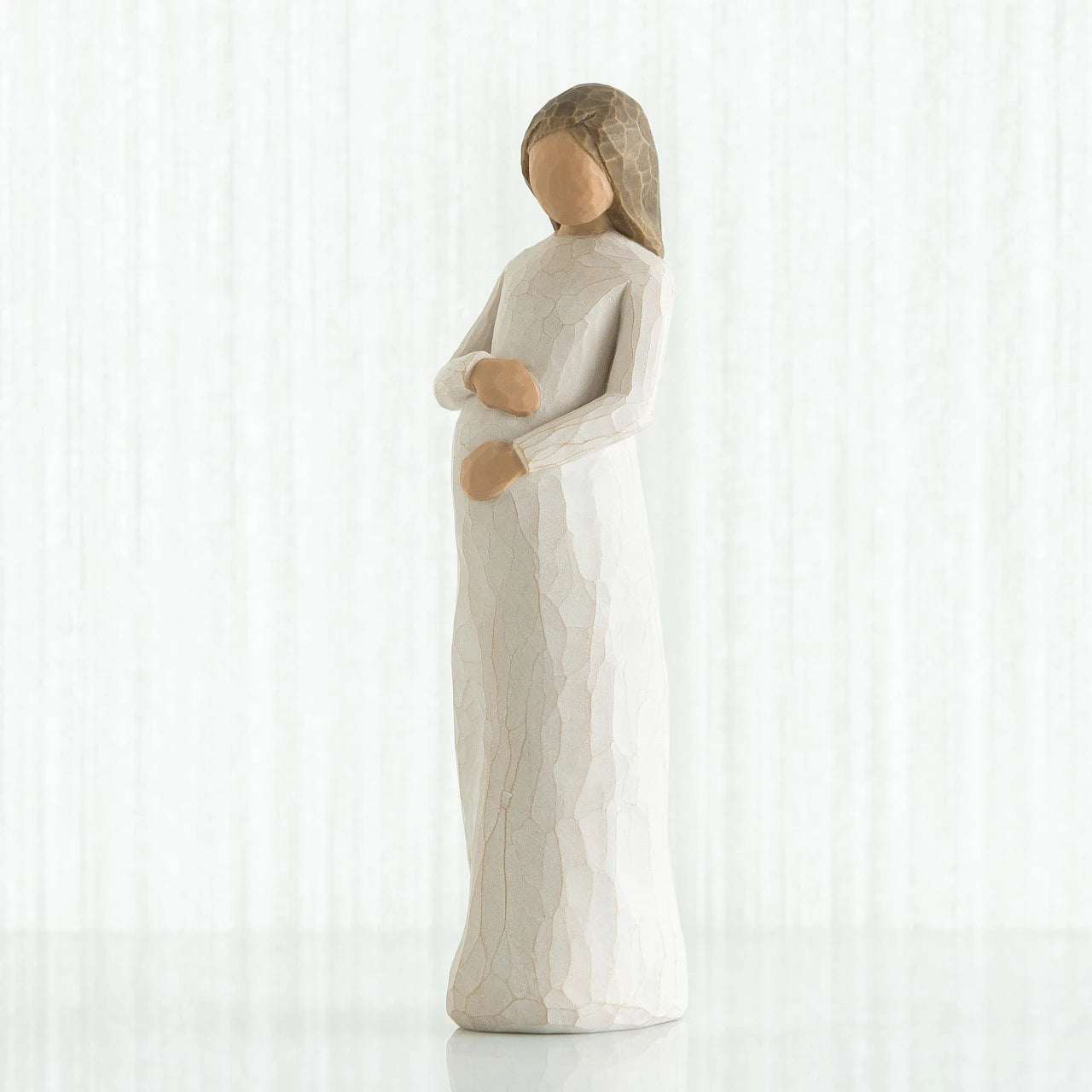 willow tree cherish Statue of a woman holding a child on a white background