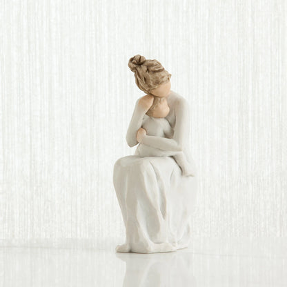willow tree for always White ceramic figurine of a woman sitting on a white background