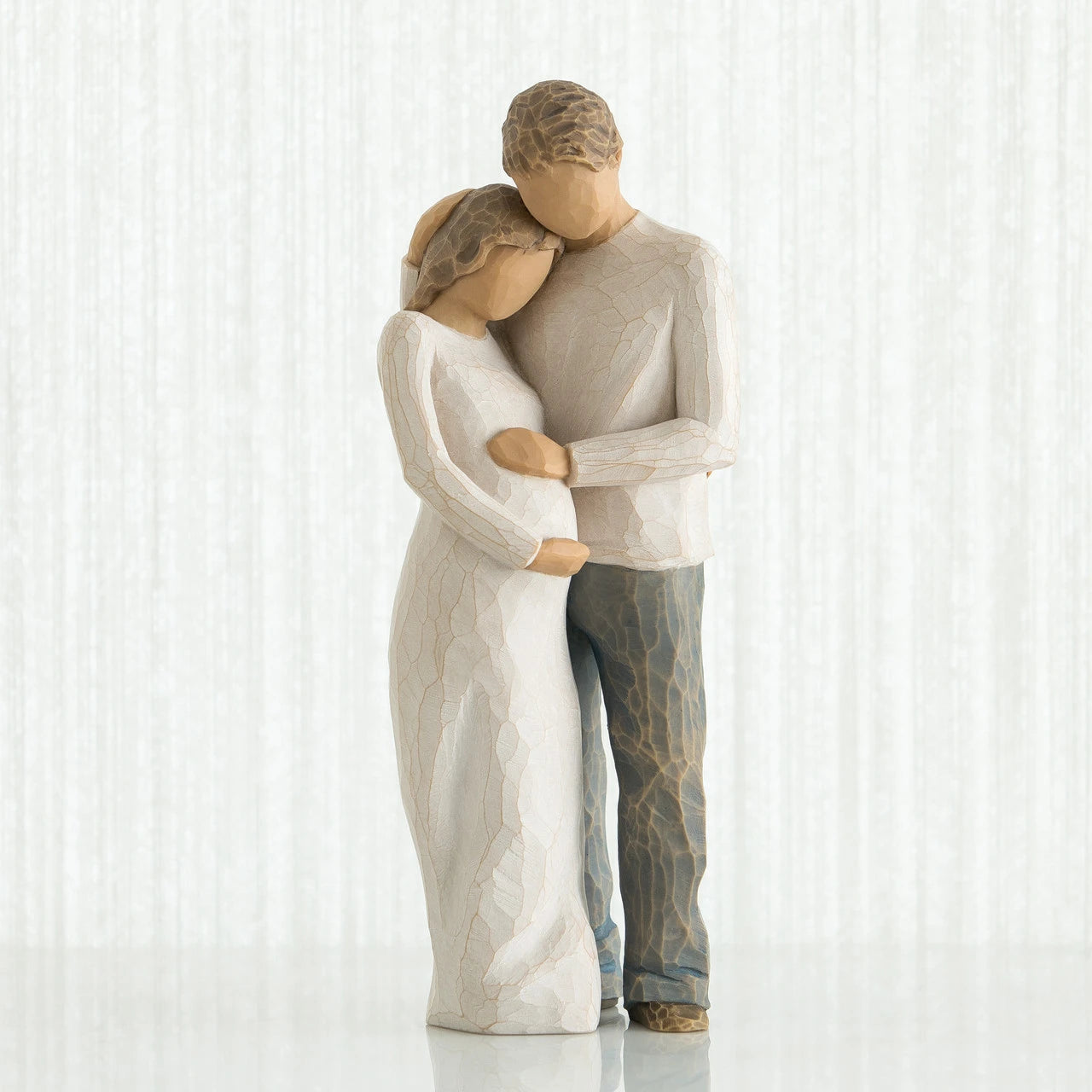 willow tree home Statue of a couple embracing on a white background